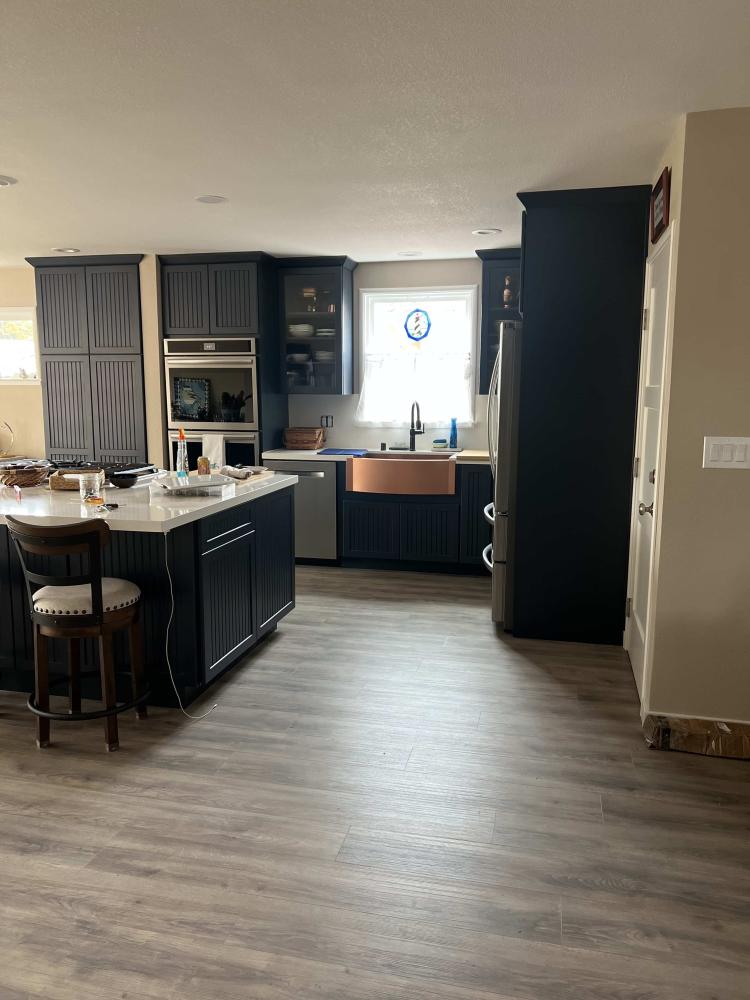 black kitchen cabinets with copper sink