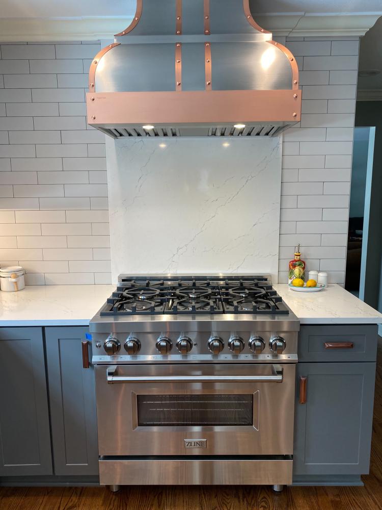 light blue cabinets with range hood