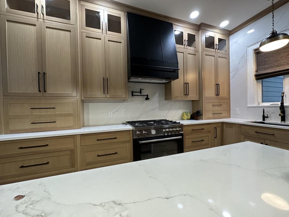 brown cabinets with black range hood